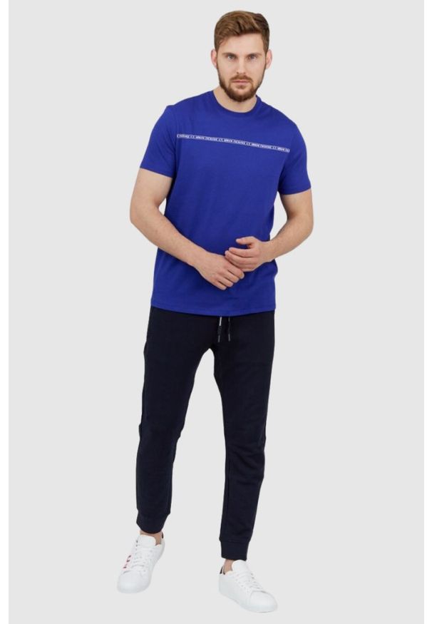 Armani Exchange - ARMANI EXCHANGE Granatowe męskie spodnie dresowe. Kolor: niebieski. Materiał: bawełna