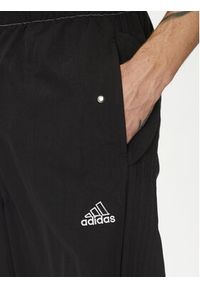 Adidas - adidas Spodnie dresowe Parachute JD5415 Czarny Loose Fit. Kolor: czarny. Materiał: syntetyk #3