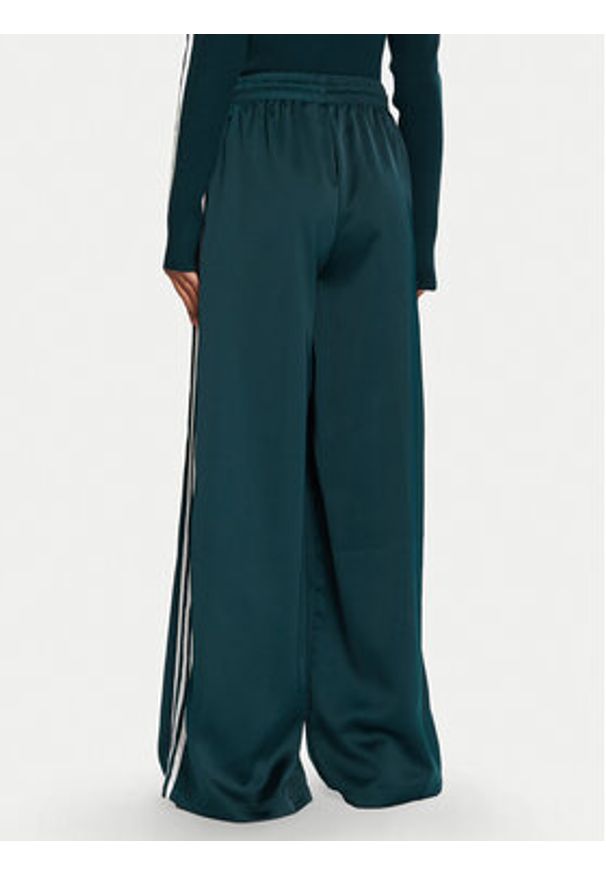 Adidas - adidas Spodnie dresowe adicolor Satin JV7511 Zielony Wide Leg. Kolor: zielony. Materiał: syntetyk