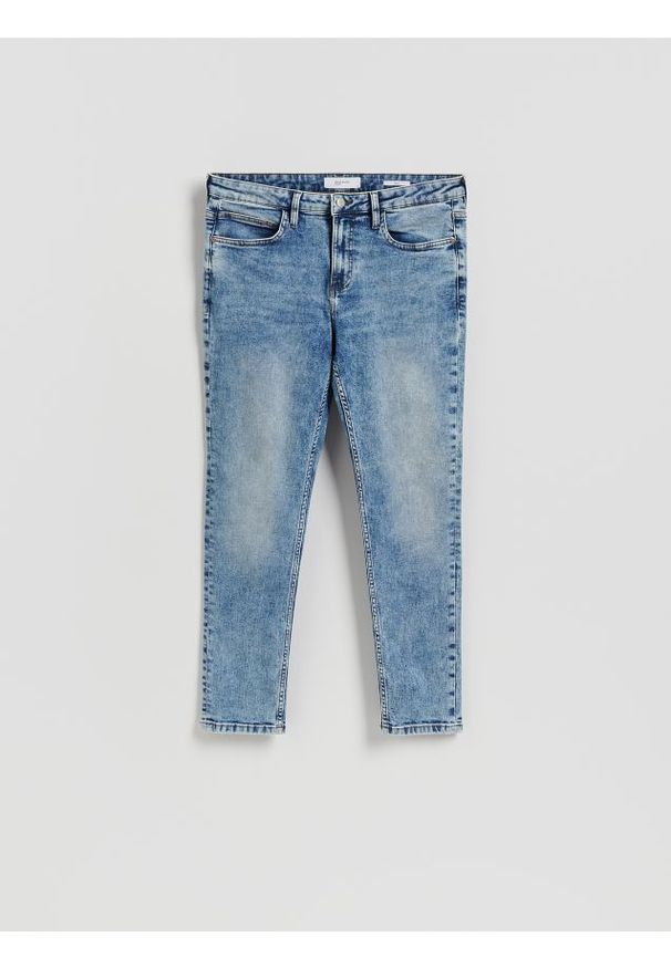 Reserved - Jeansy slim z efektem sprania - niebieski. Kolor: niebieski