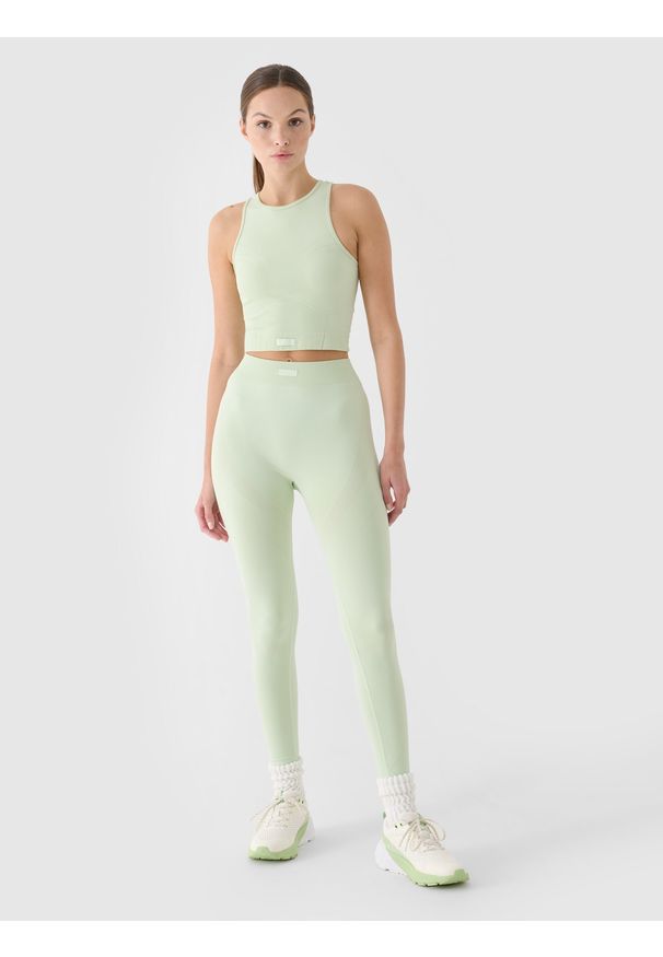 4f - 4F Crop top treningowy slim szybkoschnący damski - turkusowy XS/S. Kolor: turkusowy. Materiał: włókno, dzianina, materiał, syntetyk. Długość rękawa: na ramiączkach. Wzór: gładki, ze splotem. Sport: fitness