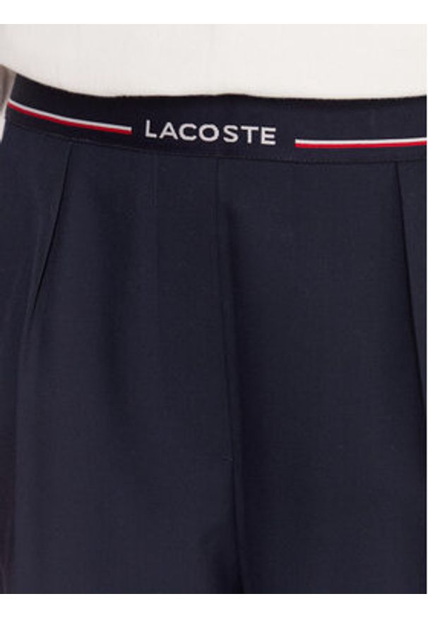 Lacoste Spodnie materiałowe HF5307 Granatowy Relaxed Fit. Kolor: niebieski. Materiał: syntetyk
