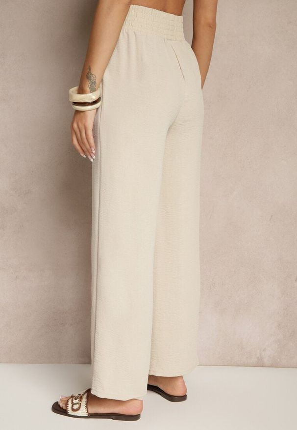 Renee - Beżowe Szerokie Spodnie High Waist z Gumką w Pasie Savimirae. Okazja: na co dzień. Stan: podwyższony. Kolor: beżowy. Styl: casual, elegancki