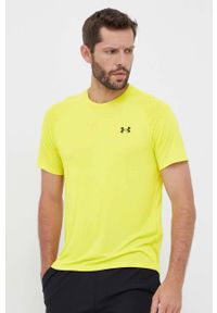 Under Armour t-shirt treningowy kolor żółty gładki. Kolor: żółty. Materiał: skóra, materiał. Długość rękawa: raglanowy rękaw. Wzór: gładki