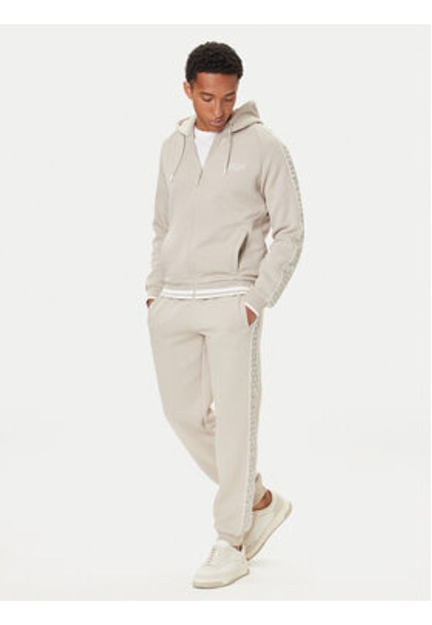 Guess Spodnie dresowe Z5BB18 KB3P2 Beżowy Regular Fit. Kolor: beżowy. Materiał: bawełna