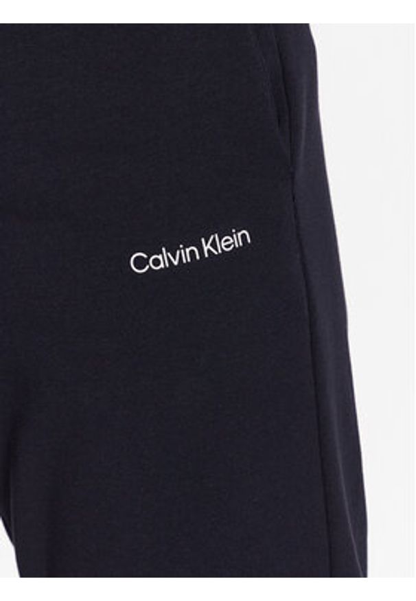 Calvin Klein Spodnie dresowe Micro Logo K10K109940 Granatowy Regular Fit. Kolor: niebieski. Materiał: bawełna, syntetyk