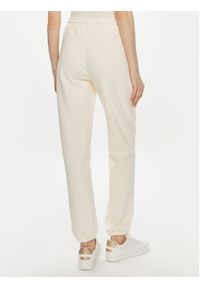TOMMY HILFIGER - Tommy Hilfiger Spodnie dresowe Monotype WW0WW41572 Beżowy Regular Fit. Kolor: beżowy. Materiał: bawełna #2