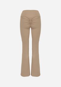Born2be - Beżowe Legginsy Typu Dzwony z Wysokim Stanem Orralise. Stan: podwyższony. Kolor: beżowy. Materiał: tkanina. Styl: klasyczny