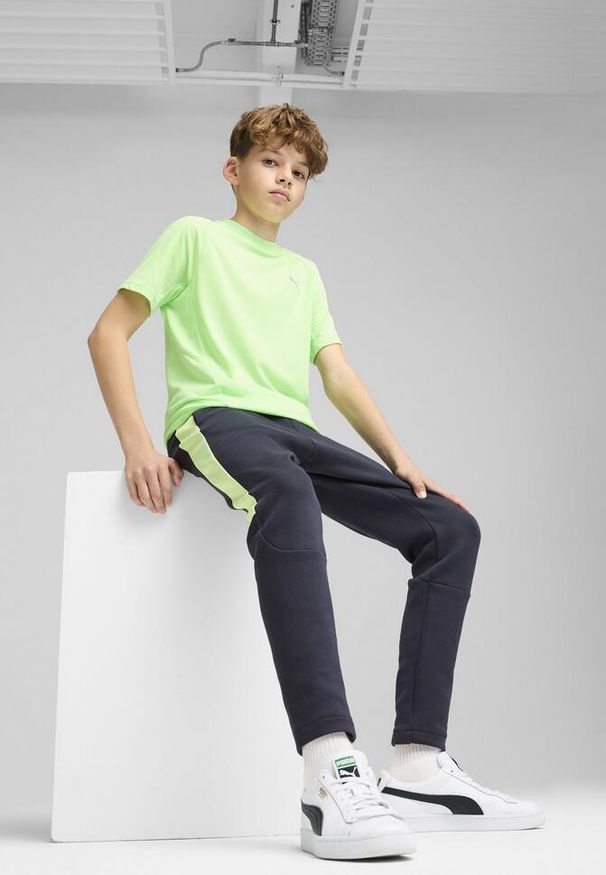 Puma - Młodzieżowe spodnie Evostripe PUMA New Navy Blue. Kolor: niebieski
