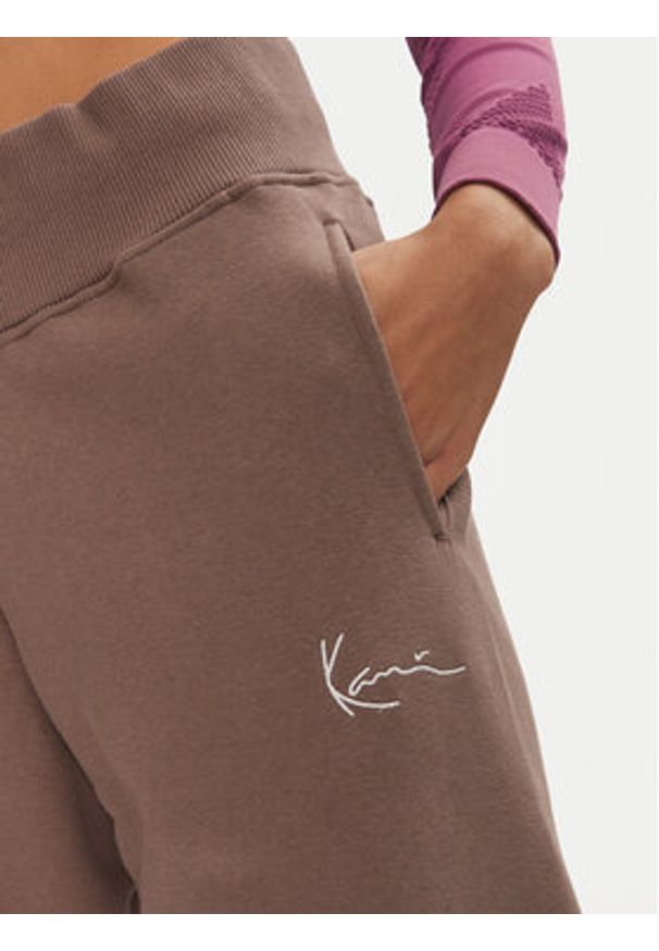 Karl Kani Spodnie dresowe Small Signature 61030014 Beżowy Relaxed Fit. Kolor: beżowy. Materiał: syntetyk