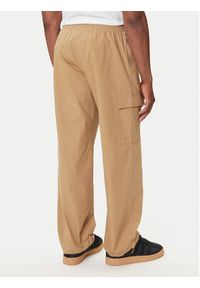 Adidas - adidas Spodnie dresowe Trefoil Essentials JX3912 Beżowy Loose Fit. Kolor: beżowy. Materiał: bawełna