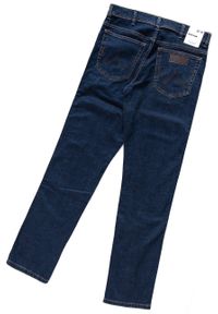 Wrangler - WRANGLER TEXAS SLIM MĘSKIE SPODNIE JEANSOWE CROSS GAME W12S8311U 112126497. Stan: podwyższony