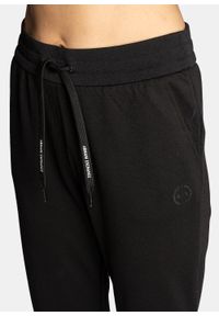 Spodnie dresowe damskie czarne Armani Exchange 8NYP97 YJ1GZ 1200. Kolor: czarny. Materiał: dresówka