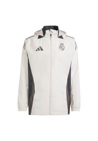 Adidas - Kurtka dresowa zewnętrzna Real Madrid 2024/25. Kolor: różowy. Materiał: dresówka. Sport: outdoor, piłka nożna #1
