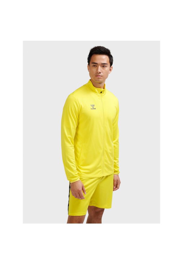 Kurtka z dresu Hummel Essential. Kolor: żółty. Materiał: dresówka. Sport: fitness