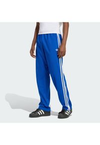 Adidas - adidas Spodnie dresowe adicolor Firebird KD4079 Niebieski Regular Fit. Kolor: niebieski. Materiał: syntetyk #1