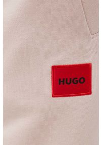 Hugo Spodnie męskie kolor transparentny gładkie. Kolor: beżowy. Materiał: dzianina, bawełna. Wzór: gładki
