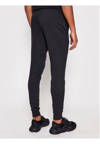 New Balance Spodnie dresowe C C F Pant MP03904 Czarny Athletic Fit. Kolor: czarny. Materiał: bawełna, dresówka, syntetyk