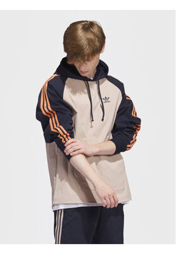 Adidas - adidas Bluza SST Hooded Windbreaker IC5537 Brązowy Regular Fit. Kolor: brązowy. Materiał: syntetyk
