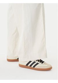 Adidas - adidas Spodnie dresowe Pearl Firebird KE3393 Écru Loose Fit. Kolor: kremowy. Materiał: syntetyk #4