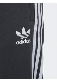 Adidas - adidas Spodnie dresowe 3-Stripes Joggers IC3127 Szary Regular Fit. Kolor: szary. Materiał: bawełna