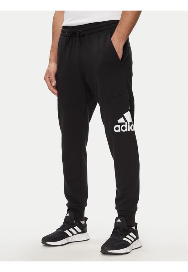 Adidas - adidas Spodnie dresowe Essentials French Terry Tapered Cuff Logo Joggers HA4342 Czarny Regular Fit. Kolor: czarny. Materiał: bawełna