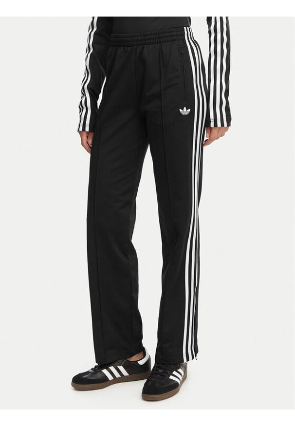 Adidas - adidas Spodnie dresowe Firebird Classic KD5575 Czarny Regular Fit. Kolor: czarny. Materiał: syntetyk