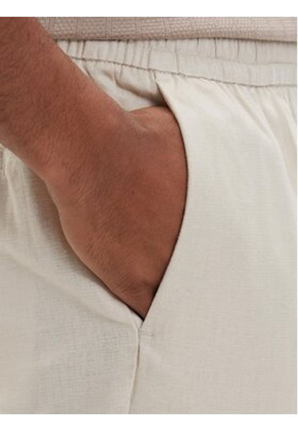 Calvin Klein Spodnie materiałowe LV04LF619G Beżowy jasny Straight Fit. Kolor: beżowy. Materiał: bawełna, len