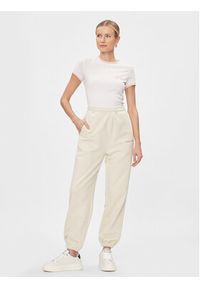 Tommy Jeans Spodnie dresowe Classics DW0DW17309 Écru Relaxed Fit. Materiał: bawełna