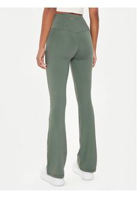 Guess Spodnie materiałowe V4YB15 KCD02 Beżowy Slim Fit. Kolor: beżowy. Materiał: syntetyk