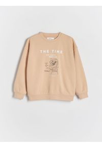 Reserved - Bluza oversize z nadrukiem - beżowy. Kolor: beżowy. Materiał: dzianina, bawełna. Wzór: nadruk