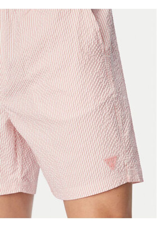Guess Szorty kąpielowe F6GT11 WN342 Różowy jasny Regular Fit. Kolor: różowy. Materiał: syntetyk