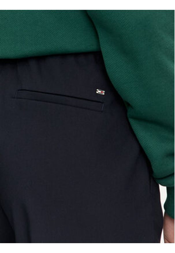 TOMMY HILFIGER - Tommy Hilfiger Chinosy Travel WW0WW43632 Granatowy Slim Fit. Kolor: niebieski. Materiał: syntetyk