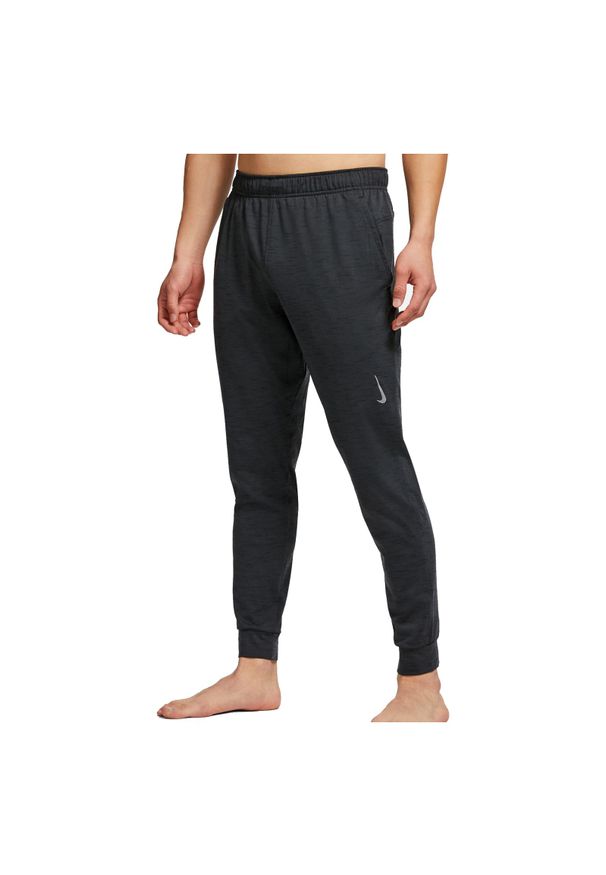 Spodnie treningowe męskie Nike Yoga Dri-FIT CZ2208. Materiał: materiał, włókno, dresówka, dzianina, poliester. Technologia: Dri-Fit (Nike). Wzór: gładki. Sport: fitness