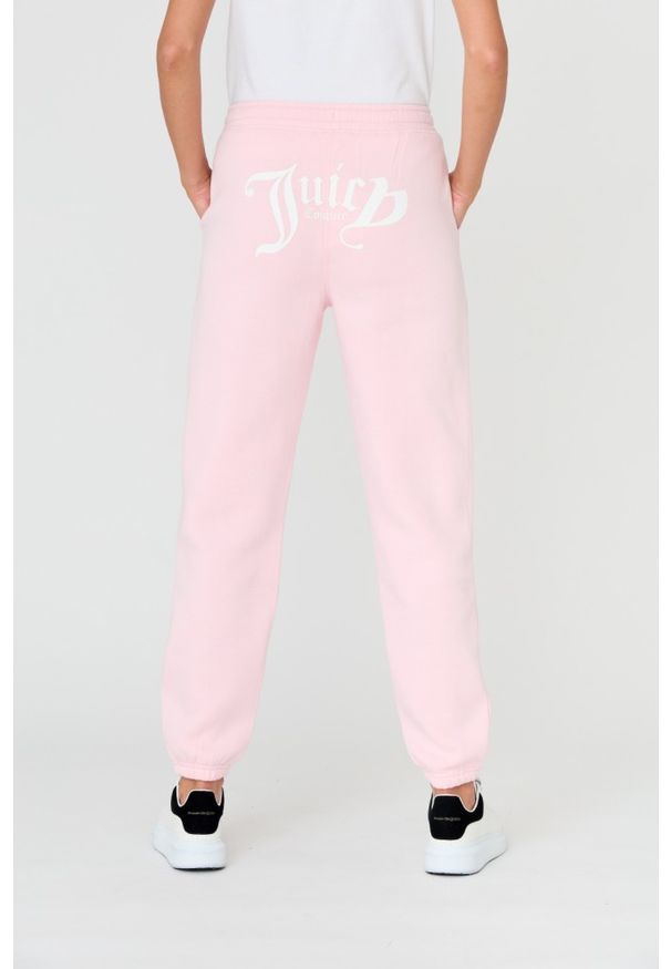 Juicy Couture - JUICY COUTURE Różowe damskie spodnie Sora, Rozmiar M. Kolor: różowy. Materiał: guma, bawełna