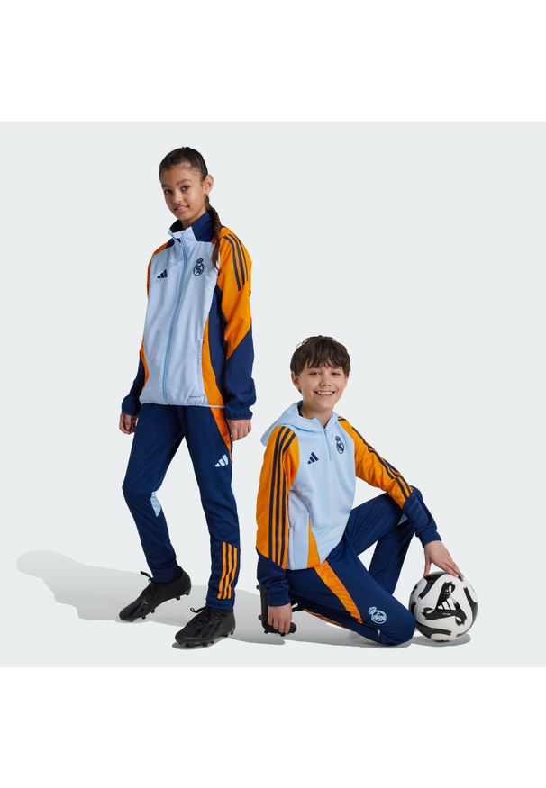 Adidas - Spodnie Real Madrid Tiro 24 Competition Training Kids. Kolor: wielokolorowy, niebieski, pomarańczowy. Materiał: materiał. Sport: piłka nożna, fitness