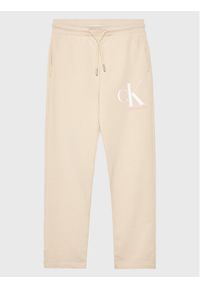 Calvin Klein Jeans Spodnie dresowe Monogram IG0IG01985 Beżowy Regular Fit. Kolor: beżowy. Materiał: bawełna #1