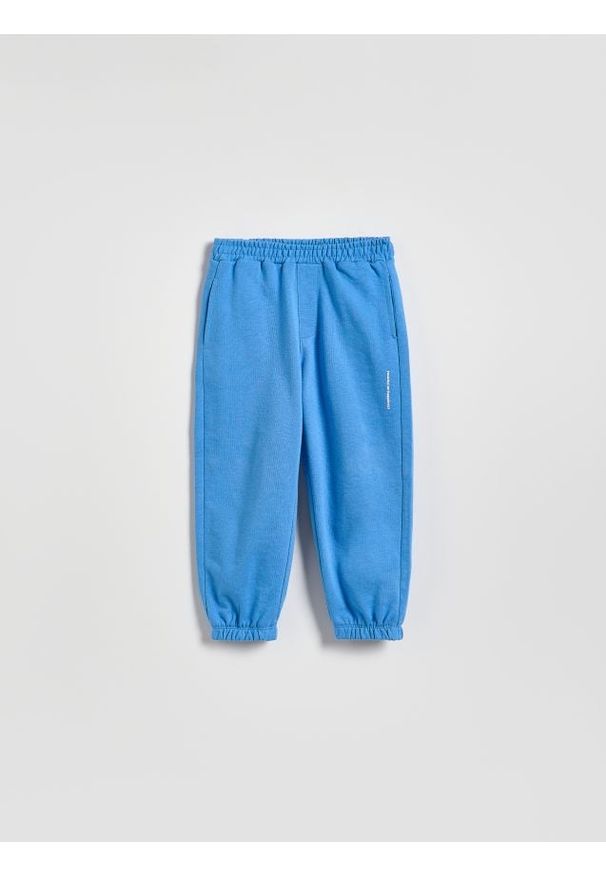 Reserved - Bawełniane spodnie jogger - niebieski. Kolor: niebieski. Materiał: bawełna