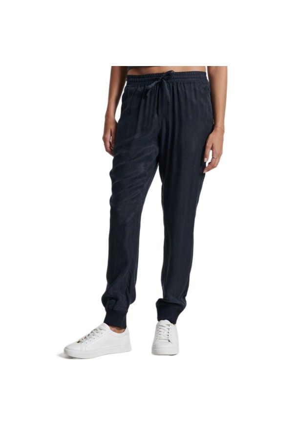 Spodnie turystyczne damskie Superdry Studios Supro Woven Jogger. Kolor: niebieski. Materiał: wiskoza