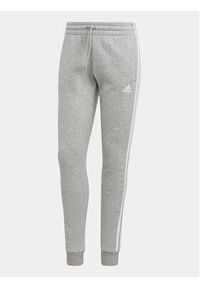 Adidas - adidas Spodnie dresowe Essentials 3-Stripes IL3282 Szary Slim Fit. Kolor: szary. Materiał: bawełna