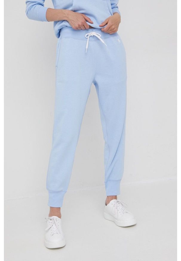 Polo Ralph Lauren spodnie dresowe 211780215009 damskie gładkie. Stan: podwyższony. Kolor: niebieski. Materiał: dresówka. Wzór: gładki