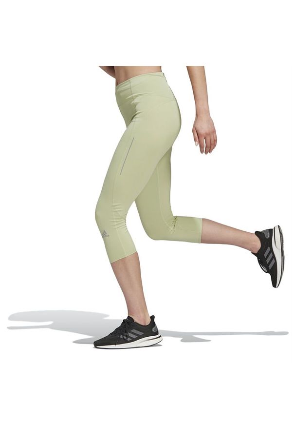 Adidas - Legginsy adidas Own The Run 3/4 Running HC1762 - zielone. Stan: podwyższony. Kolor: zielony. Materiał: poliester, elastan. Wzór: aplikacja. Styl: klasyczny. Sport: bieganie