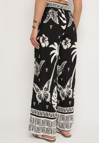Born2be - Czarne Spodnie z Tropikalnym Wzorem i Szerokimi Nogawkami Emivelli. Okazja: na co dzień. Kolor: czarny. Styl: elegancki, casual #7