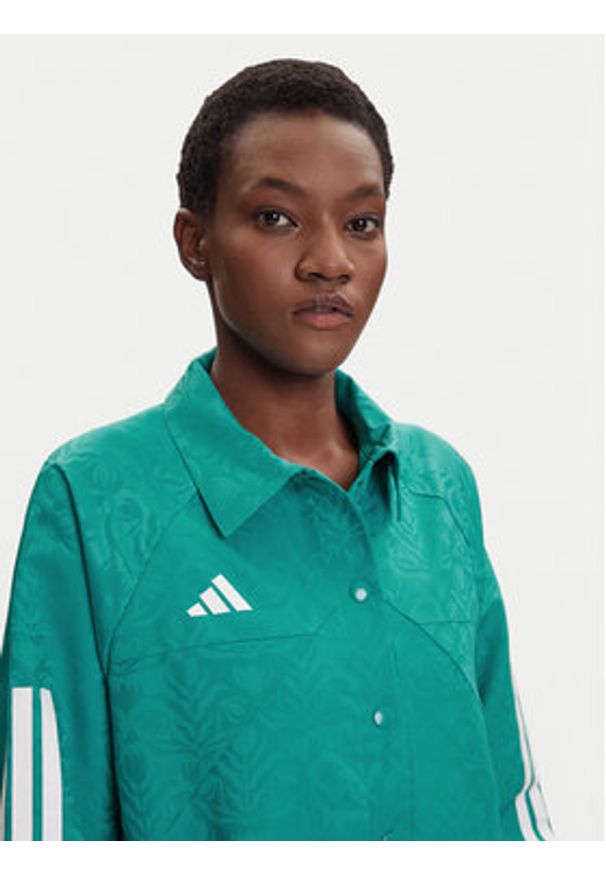 Adidas - adidas Kurtka przejściowa Tiro x Common Goal Coaches JL9204 Turkusowy Loose Fit. Kolor: turkusowy. Materiał: syntetyk