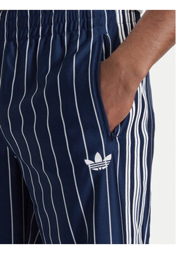 Adidas - adidas Spodnie dresowe Firebird Pinstripes Track Pants KR7231 Granatowy Regular Fit. Kolor: niebieski. Materiał: syntetyk