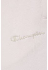 Champion spodnie 217404 kolor różowy z aplikacją. Kolor: różowy. Materiał: włókno, dzianina, materiał. Wzór: aplikacja #2