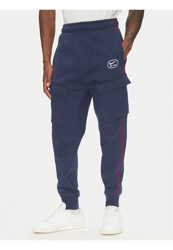 Nike Spodnie dresowe HM0180 Granatowy Regular Fit. Kolor: niebieski. Materiał: bawełna