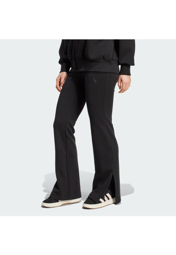 Adidas - Spodnie Soft Lux Flared. Kolor: czarny. Sport: fitness