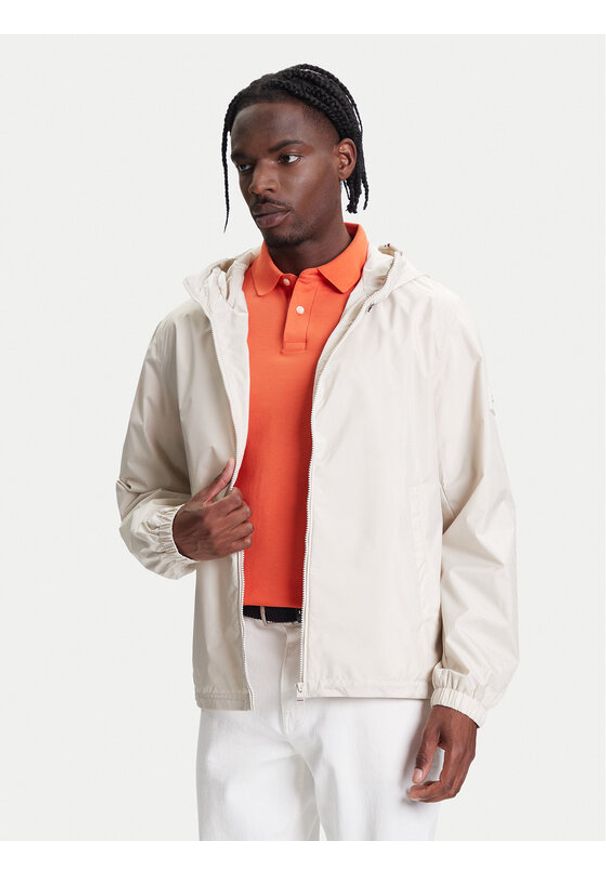 TOMMY HILFIGER - Tommy Hilfiger Kurtka przejściowa MW0MW40225 Beżowy Regular Fit. Kolor: beżowy. Materiał: syntetyk