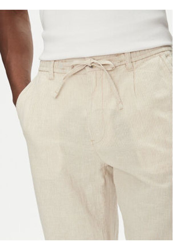 Lindbergh Spodnie materiałowe 30-003030 Beżowy Relaxed Fit. Kolor: beżowy. Materiał: bawełna